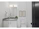 Stylish bathroom featuring a modern vanity, decorative art, and a toilet at 712 Daniels St, Raleigh, NC 27605