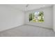 Serene bedroom with natural light, ceiling fan and a beautiful view of the surrounding landscape at 712 Daniels St, Raleigh, NC 27605