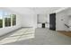 Bright bonus room features a wet bar, carpet, and a large window overlooking the outdoors at 712 Daniels St, Raleigh, NC 27605