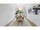 Dining room with contemporary lighting and adjacent views of the outdoors at 712 Daniels St, Raleigh, NC 27605
