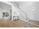 Elegant foyer features hardwood floors, staircase, and decorative lighting for a grand entrance at 712 Daniels St, Raleigh, NC 27605