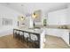 Bright kitchen with a large island, modern appliances, and stylish pendant lighting at 712 Daniels St, Raleigh, NC 27605