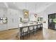Modern kitchen with a large island, pendant lighting, and high-end appliances at 712 Daniels St, Raleigh, NC 27605