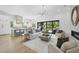 Bright, open living room seamlessly connects to a modern kitchen and outdoor space at 712 Daniels St, Raleigh, NC 27605