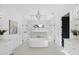 Stunning main bathroom features a soaking tub, dual vanities, and a glass-enclosed shower at 712 Daniels St, Raleigh, NC 27605