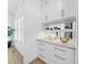 Built-in storage features marble counters, custom white cabinetry and gold hardware at 712 Daniels St, Raleigh, NC 27605