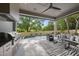 Inviting outdoor patio with a built-in grill, comfortable seating area, and a refreshing pool at 712 Daniels St, Raleigh, NC 27605