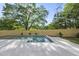 A refreshing swimming pool is surrounded by a wooden fence and lush greenery in this backyard oasis at 712 Daniels St, Raleigh, NC 27605