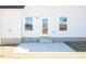 A backyard concrete patio area and exterior access door at 525 Glenkirk Pl, Garner, NC 27529