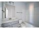 Clean bathroom featuring a vanity with a sink, toilet, and bathtub with white tile surround at 525 Glenkirk Pl, Garner, NC 27529