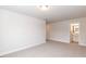 Spacious bedroom leading to ensuite bath features neutral walls and carpet at 525 Glenkirk Pl, Garner, NC 27529