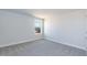 Bright bedroom features neutral walls, plush carpet, a large window, and ample natural light at 525 Glenkirk Pl, Garner, NC 27529