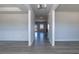 Bright hallway with modern gray flooring and neutral paint throughout a new home at 525 Glenkirk Pl, Garner, NC 27529