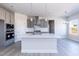 Spacious kitchen with stainless steel appliances and a large center island at 525 Glenkirk Pl, Garner, NC 27529