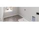 Practical laundry room with tile flooring, window, and utility connections at 525 Glenkirk Pl, Garner, NC 27529