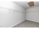 A walk-in closet features wire shelving for ample storage and neutral carpet at 525 Glenkirk Pl, Garner, NC 27529