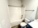 This bathroom features a bathtub/shower combination with modern fixtures and a neutral paint scheme at 55 Capeside Ct, Lillington, NC 27546