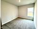 Bedroom with neutral carpet and a large window allowing lots of natural light at 55 Capeside Ct, Lillington, NC 27546