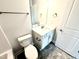 Bathroom featuring a toilet, mirror, sink, and storage space at 31 Capeside Ct, Lillington, NC 27546