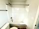 Bright white bathroom featuring a shower and tub combo with modern fixtures at 31 Capeside Ct, Lillington, NC 27546
