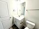 Well-lit bathroom features a vanity with a sink and ample storage at 31 Capeside Ct, Lillington, NC 27546