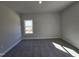 Bedroom with neutral walls, carpet, and a bright window at 31 Capeside Ct, Lillington, NC 27546