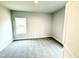Bright, carpeted bedroom offers a serene and comfortable living space at 31 Capeside Ct, Lillington, NC 27546