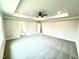 Spacious bedroom featuring tray ceiling, ceiling fan, neutral colors, and carpeted flooring at 31 Capeside Ct, Lillington, NC 27546