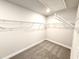 Walk-in closet with carpeted floors and wire shelving at 31 Capeside Ct, Lillington, NC 27546