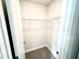 Walk-in closet with wire shelving and carpeted floor at 31 Capeside Ct, Lillington, NC 27546