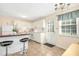 Cozy kitchen with stainless steel appliances, a breakfast bar, and natural light at 1002 Willow Dr # Apt 7, Chapel Hill, NC 27514