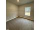 Walk-in closet featuring built-in wire shelving and a window at 105 Watermelon Dr, Franklinton, NC 27525