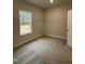 Walk-in closet featuring built-in wire shelving and a window at 105 Watermelon Dr, Franklinton, NC 27525