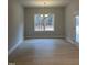 Open dining room with hardwood floors and a pendant light above at 105 Watermelon Dr, Franklinton, NC 27525
