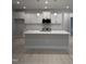 Contemporary kitchen with white cabinets, stainless steel appliances, and an island with pendant lighting at 105 Watermelon Dr, Franklinton, NC 27525