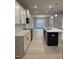 Stylish kitchen with a center island, white cabinets, quartz countertops, and stainless steel appliances at 105 Watermelon Dr, Franklinton, NC 27525