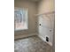 Bright laundry room with a window, shelf, and hookups for appliances at 105 Watermelon Dr, Franklinton, NC 27525