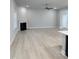 Spacious living room features wood floors, a fireplace, and an open concept design at 105 Watermelon Dr, Franklinton, NC 27525