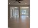 Open-concept living room with hardwood floors and views into the entry and dining room at 105 Watermelon Dr, Franklinton, NC 27525