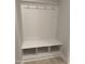 Mudroom featuring coat hooks and a bench with storage compartments at 105 Watermelon Dr, Franklinton, NC 27525