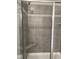 Modern shower features gray tile, decorative band, glass door, and a built-in corner seat at 105 Watermelon Dr, Franklinton, NC 27525