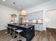 Stylish kitchen with a large center island, pendant lighting, and modern fixtures at 144 W Beech Slope Ct, Chapel Hill, NC 27517