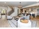 Spacious living room featuring hardwood floors, contemporary furniture, and an open layout at 144 W Beech Slope Ct, Chapel Hill, NC 27517