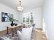 Bright office featuring a modern light fixture, large window, and a neutral palette at 144 W Beech Slope Ct, Chapel Hill, NC 27517