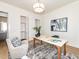 Bright office featuring a modern light fixture, a desk, and a view of the bathroom at 144 W Beech Slope Ct, Chapel Hill, NC 27517