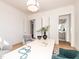 Bright office featuring a modern light fixture, a desk, and a view of the bathroom at 144 W Beech Slope Ct, Chapel Hill, NC 27517