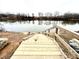 Wooden boat dock on the community's river or lake, offers water access for boating and enjoying the waterfront at 19 Streamline Ct, Lillington, NC 27546