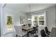 Bright dining room with wood table and six chairs, access to backyard at 19 Streamline Ct, Lillington, NC 27546