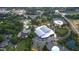 Aerial view featuring a complex with sports facilities and ample parking surrounded by lush greenery at 417 E Moore St, Apex, NC 27502