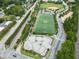 Wide aerial view showcasing a skatepark, turf athletic field, and surrounding neighborhood at 417 E Moore St, Apex, NC 27502